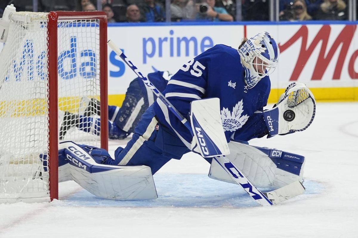 Dec 8, 2025; Toronto, Ontario, CAN; Toronto Maple Leafs goaltender Dennis Hildeby (35) makes a glove save against the Tampa Bay Lightning during the second period at Scotiabank Arena. Mandatory Credit: John E. Sokolowski-Imagn Images