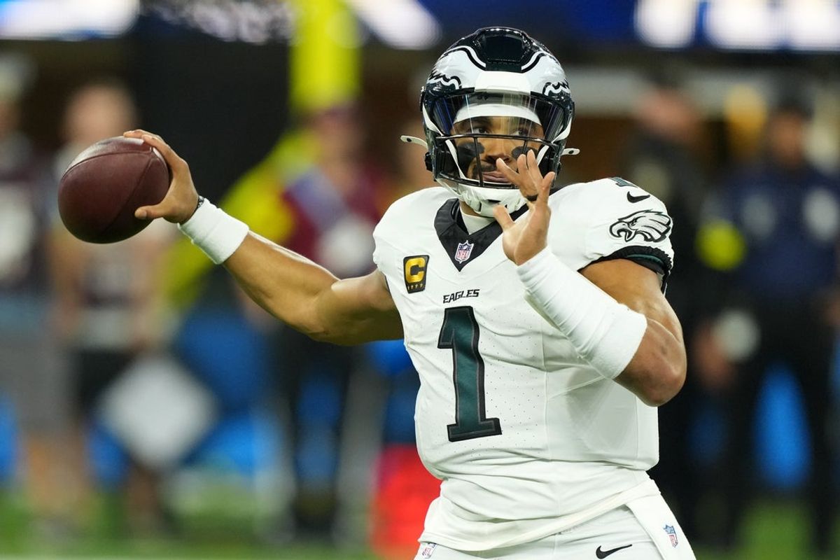 Dec 8, 2025; Inglewood, California, USA;  Philadelphia Eagles quarterback Jalen Hurts (1) passes against the Los Angeles Chargers in the first half at SoFi Stadium. Mandatory Credit: Kirby Lee-Imagn Images