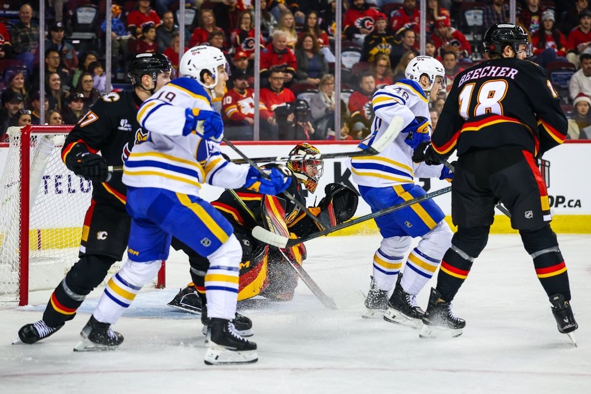 Dec 8, 2025; Calgary, Alberta, CAN; Calgary Flames goaltender Dustin Wolf (32) guards his net against the Buffalo Sabres during the first period at Scotiabank Saddledome. Mandatory Credit: Sergei Belski-Imagn Images