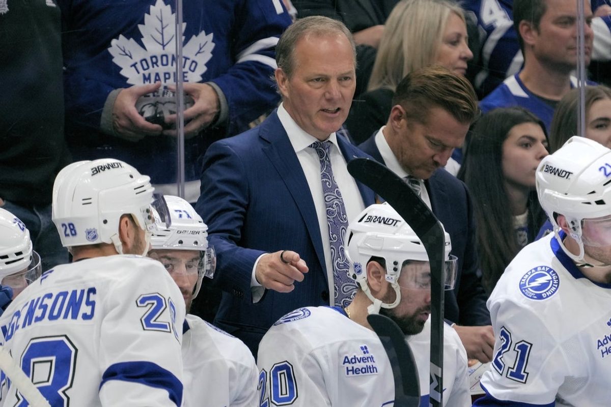 Dec 8, 2025; Toronto, Ontario, CAN; Tampa Bay Lightning head coach Jon Cooper talks to his players during a break in the action against the Toronto Maple Leafs at Scotiabank Arena. Mandatory Credit: John E. Sokolowski-Imagn Images