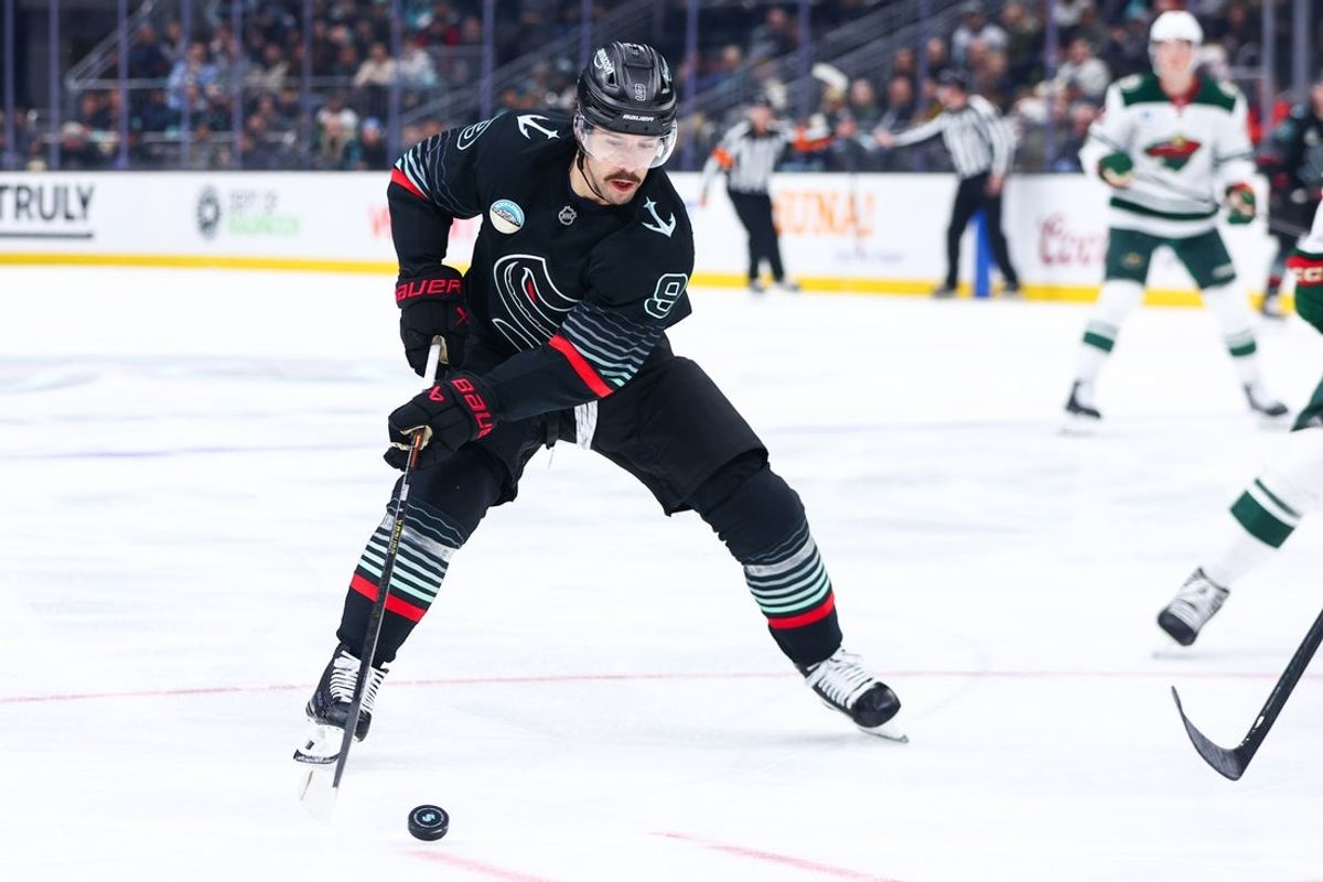 Dec 8, 2025; Seattle, Washington, USA; Seattle Kraken center Chandler Stephenson (9) moves the puck in the second period against the Minnesota Wild at Climate Pledge Arena. Mandatory Credit: Kevin Ng-Imagn Images
