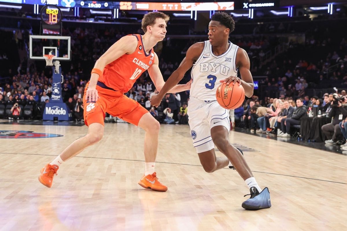 Dec 9, 2025; New York, New York, USA;  BYU Cougars forward AJ Dybantsa (3) looks to drive past Clemson Tigers forward Jake Wahlin (10) in the first half at Madison Square Garden. Mandatory Credit: Wendell Cruz-Imagn Images