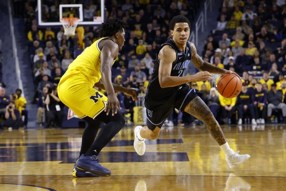 Dec 9, 2025; Ann Arbor, Michigan, USA;  Villanova Wildcats guard Bryce Lindsay (2) dribbles defended by Michigan Wolverines guard L.J. Cason (2) in the second half at Crisler Center. Mandatory Credit: Rick Osentoski-Imagn Images