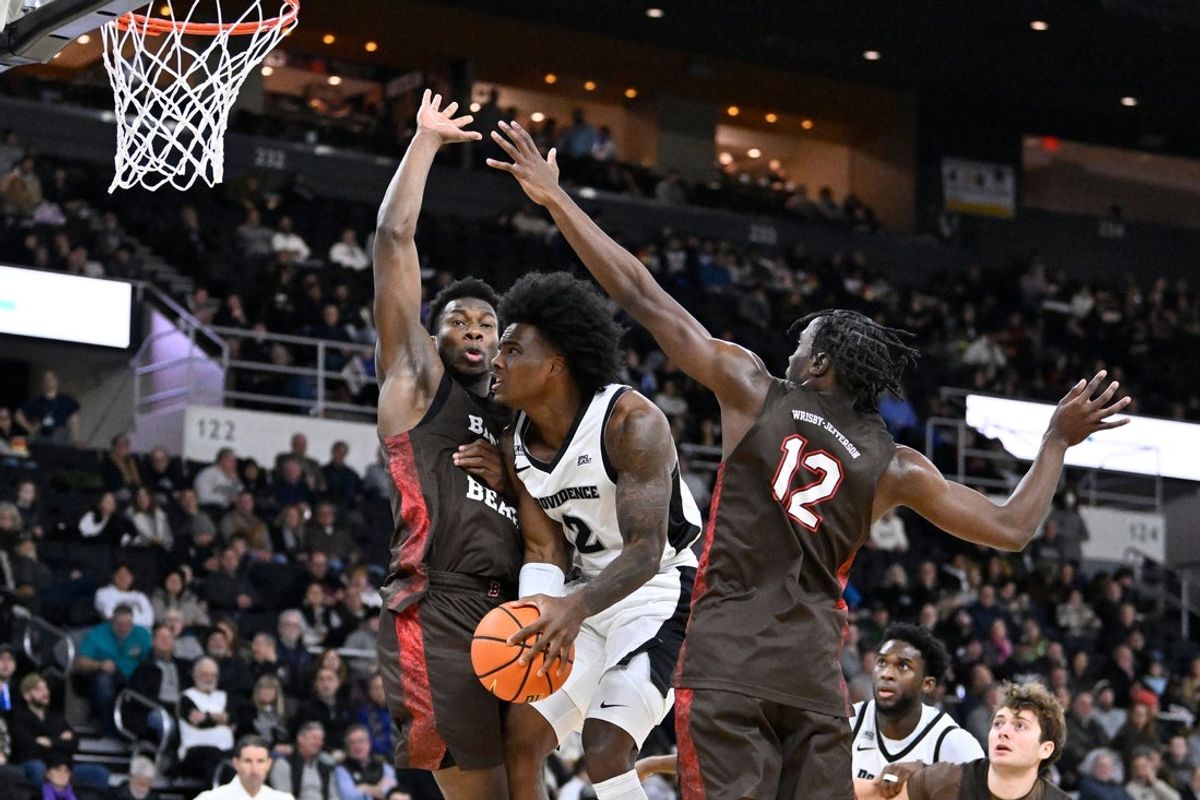 Dec 9, 2025; Providence, Rhode Island, USA; Providence Friars guard Jaylin Sellers (2) tries to shoot through Brown Bears forward N'Famara Dabo (45) and guard Malcolm Wrisby-Jefferson (12) during the first half at Amica Mutual Pavilion. Mandatory Credit: Eric Canha-Imagn Images