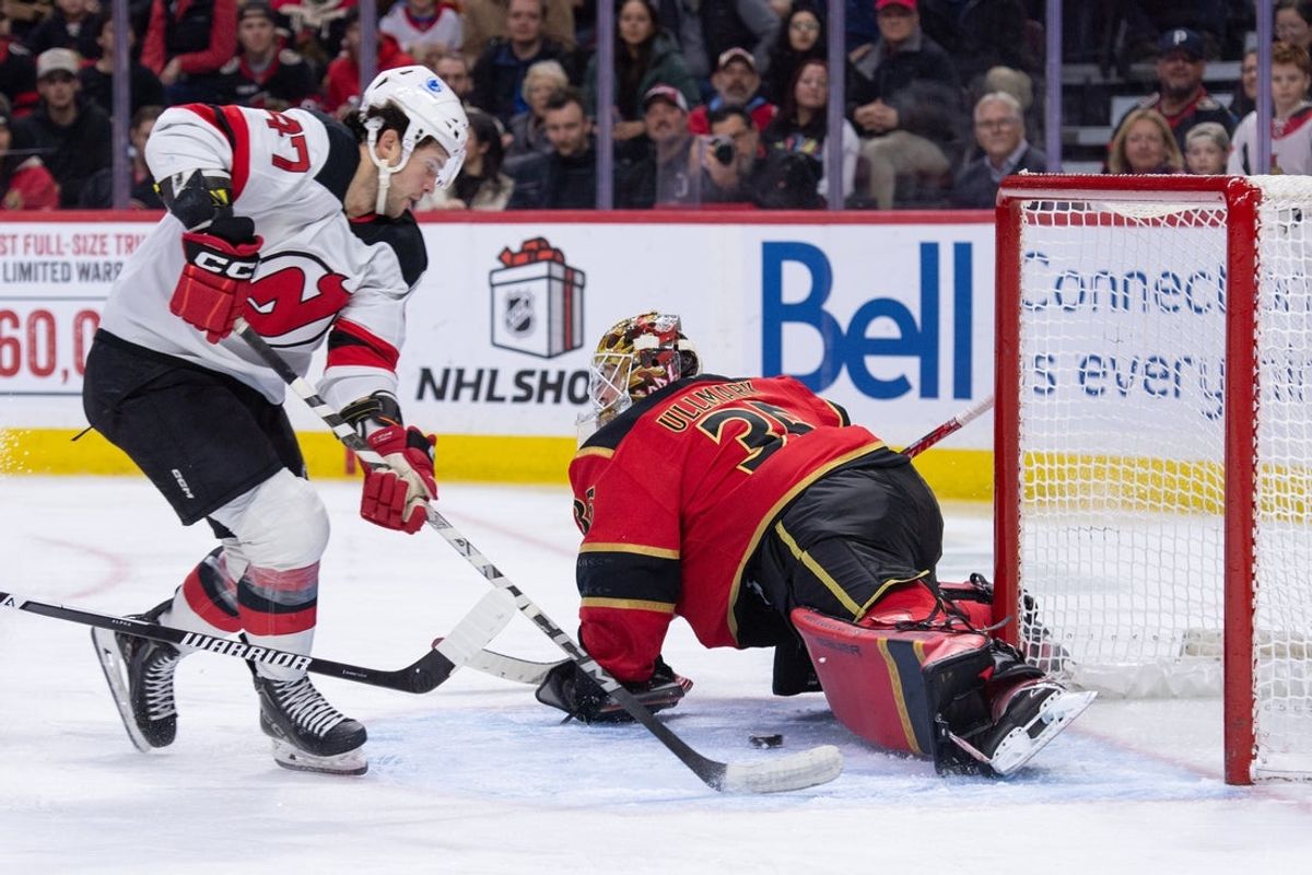 Dec 9, 2025; Ottawa, Ontario, CAN; New Jersey Devils left wing Paul Cotter (47) shoots on Ottawa Senators goalie Linus Ullmark (35) in the second period at the Canadian Tire Centre. Mandatory Credit: Marc DesRosiers-IMAGN Images