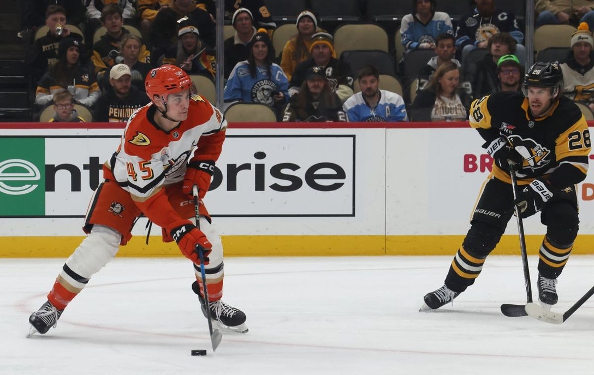 Dec 9, 2025; Pittsburgh, Pennsylvania, USA;  Anaheim Ducks right wing Beckett Sennecke (45) shoots the puck against the Pittsburgh Penguins during the second period at PPG Paints Arena. Mandatory Credit: Charles LeClaire-Imagn Images