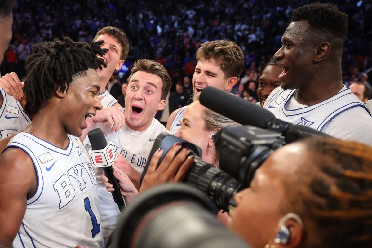 Dec 9, 2025; New York, New York, USA;  BYU Cougars guard Robert Wright III (1) celebrates with his teammates after hiting a game winning three point shot to beat the Clemson Tigers 67-64 at Madison Square Garden. Mandatory Credit: Wendell Cruz-Imagn Images