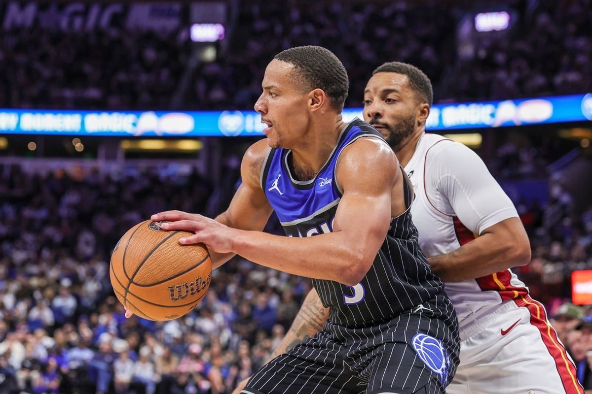 Dec 9, 2025; Orlando, Florida, USA; Orlando Magic guard Desmond Bane (3) drives to the basket against Miami Heat guard Norman Powell (24) during the second half at Kia Center. Mandatory Credit: Mike Watters-Imagn Images