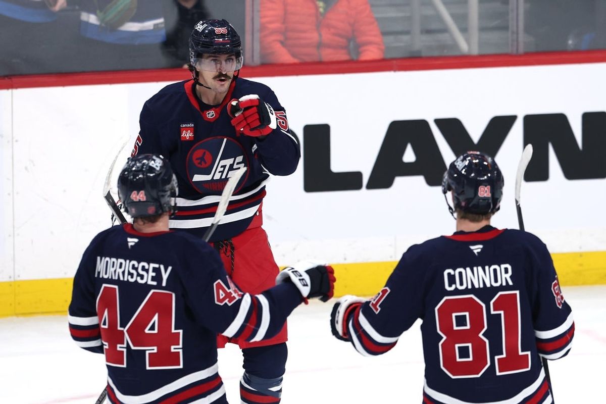 Dec 9, 2025; Winnipeg, Manitoba, CAN; Winnipeg Jets center Mark Scheifele (55) celebrates his second goal against the Dallas Stars with Josh Morrissey (44) and  Kyle Connor (81) in the second period at Canada Life Centre. Mandatory Credit: James Carey Lauder-Imagn Images