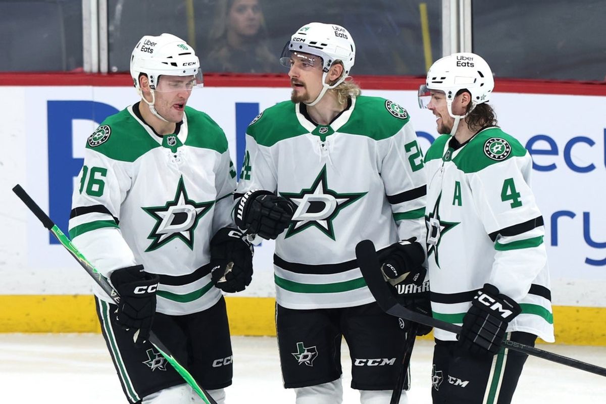 Dec 9, 2025; Winnipeg, Manitoba, CAN; Dallas Stars center Roope Hintz (24) celebrates his goal against the Winnipeg Jets  Mikko Rantanen (96) and Miro Heiskanen (4) in the second period at Canada Life Centre. Mandatory Credit: James Carey Lauder-Imagn Images