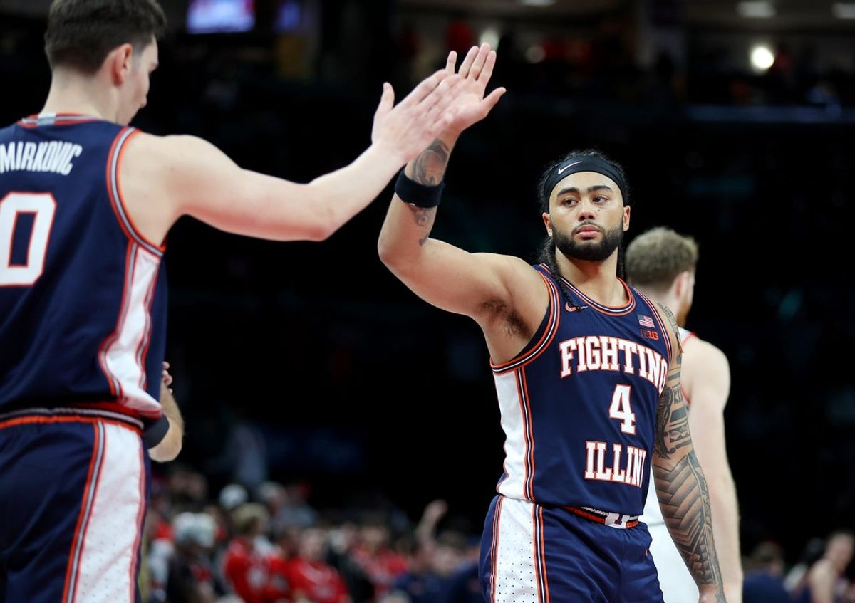 Dec 9, 2025; Columbus, Ohio, USA; Illinois Fighting Illini guard Kylan Boswell (4) celebrates as time winds down on the win against the Ohio State Buckeyes at Value City Arena. Mandatory Credit: Joseph Maiorana-Imagn Images