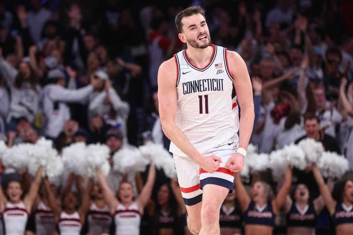 Dec 9, 2025; New York, New York, USA;  UConn Huskies forward Alex Karaban (11) celebrates after making a three point shot in the second half against the Florida Gators at Madison Square Garden. Mandatory Credit: Wendell Cruz-Imagn Images