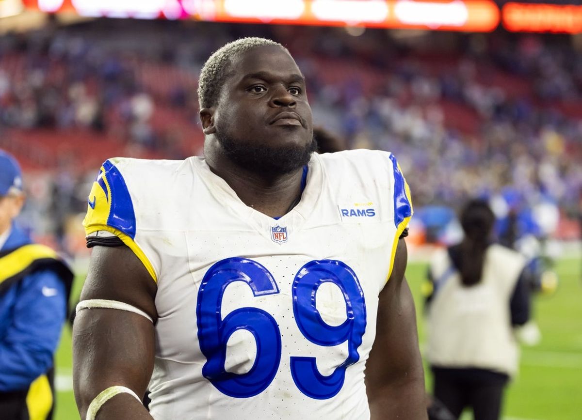 Dec 7, 2025; Glendale, Arizona, USA; Los Angeles Rams  offensive lineman Kevin Dotson (69) against the Arizona Cardinals at State Farm Stadium. Mandatory Credit: Mark J. Rebilas-Imagn Images
