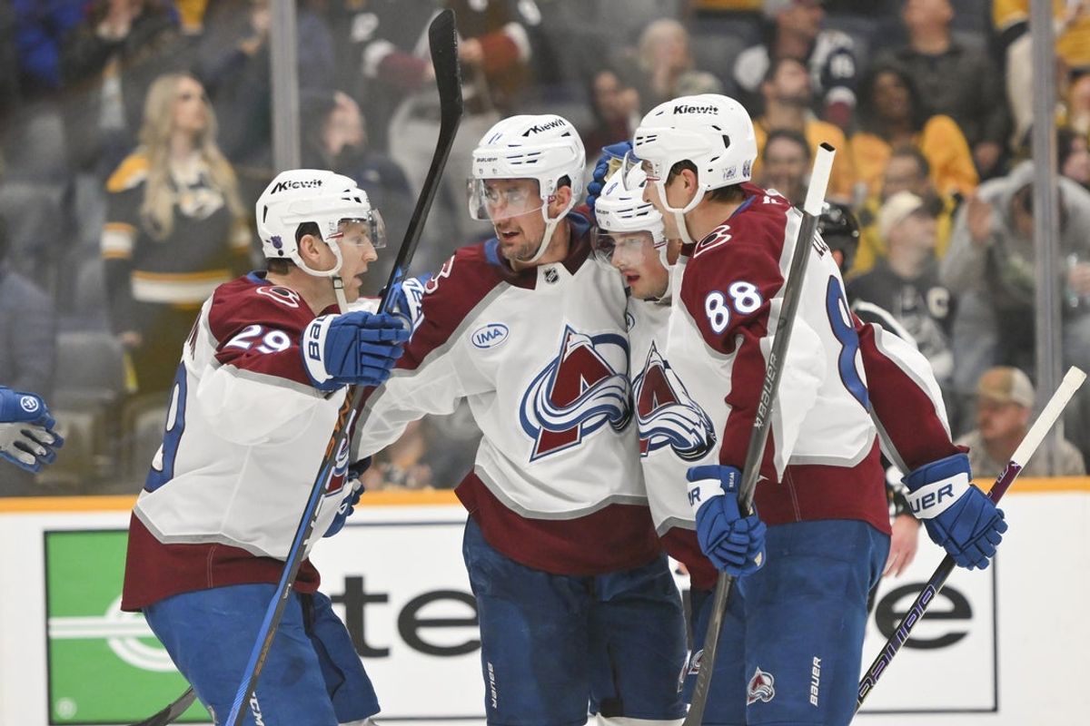 Dec 9, 2025; Nashville, Tennessee, USA;  Colorado Avalanche defenseman Cale Makar (8) celebrates with his teammates after scoring a goal against the Nashville Predators during the third period at Bridgestone Arena. Mandatory Credit: Steve Roberts-Imagn Images