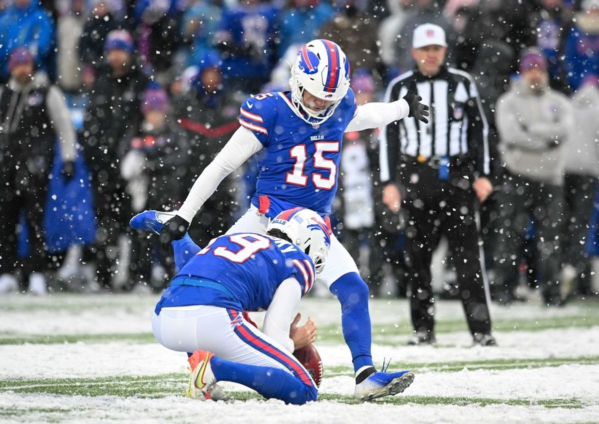 Dec 7, 2025; Orchard Park, New York, USA; Buffalo Bills place kicker Matt Prater (15) attempts an extra point against the Cincinnati Bengals with the help of punter Mitch Wishnowsky (19) in the fourth quarter at Highmark Stadium. Mandatory Credit: Mark Konezny-Imagn Images