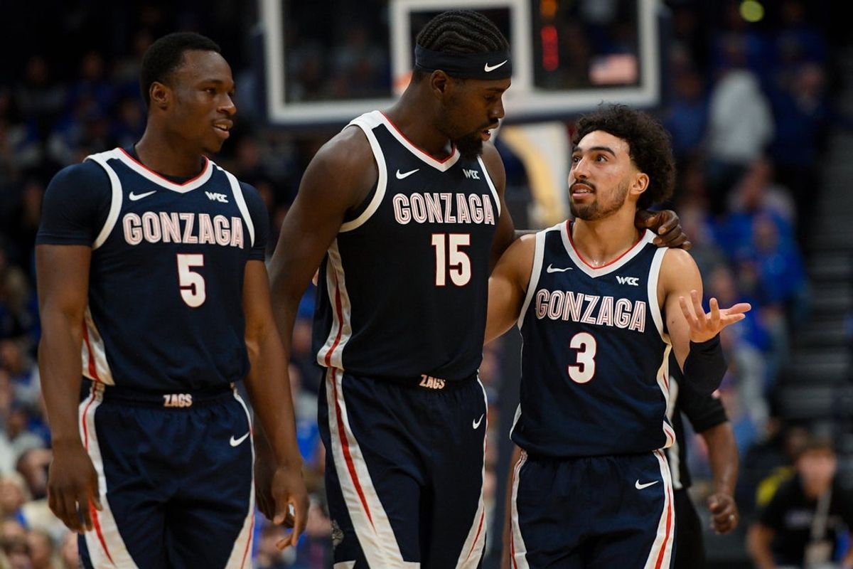 Dec 5, 2025; Nashville, TN, USA;  Gonzaga Bulldogs forward Emmanuel Innocenti (5), forward Graham Ike (15), and Gonzaga Bulldogs guard Braeden Smith (3) walk back to the bench against the Kentucky Wildcats during the first half at Bridgestone Arena. Mandatory Credit: Steve Roberts-Imagn Images