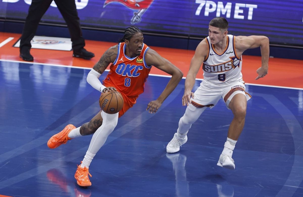 Dec 10, 2025; Oklahoma City, Oklahoma, USA; Oklahoma City Thunder guard Jalen Williams (8) drives past Phoenix Suns guard Grayson Allen (8) during the first quarter at Paycom Center. Mandatory Credit: Alonzo Adams-Imagn Images