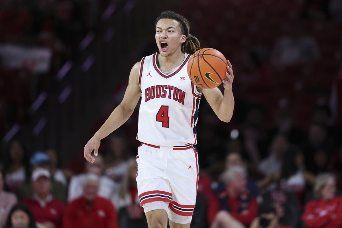 Dec 10, 2025; Houston, Texas, USA; Houston Cougars guard Kingston Flemings (4) brings the ball up the court during the first half against the Jackson State Tigers at Fertitta Center. Mandatory Credit: Troy Taormina-Imagn Images