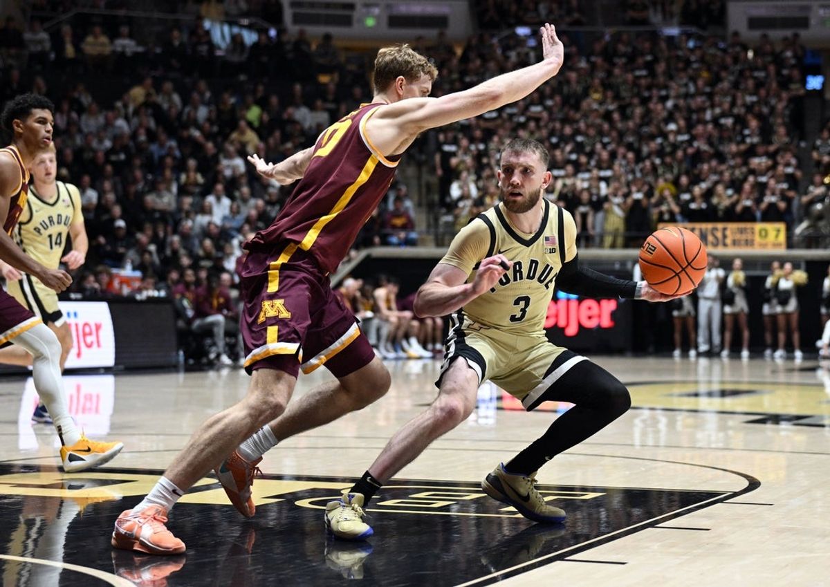 Dec 10, 2025; West Lafayette, Indiana, USA; Purdue Boilermakers guard Braden Smith (3) jukes Minnesota Golden Gophers forward Cade Tyson (10) during the second half at Mackey Arena. Mandatory Credit: Marc Lebryk-Imagn Images