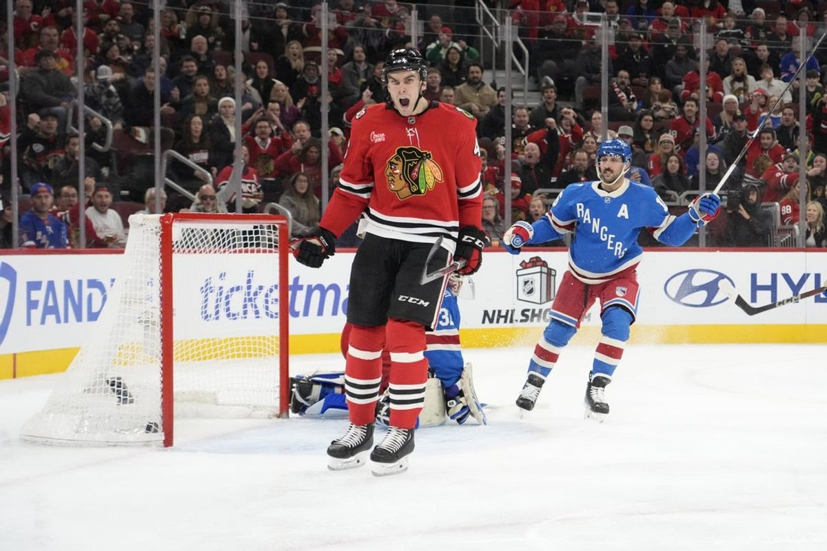 Dec 10, 2025; Chicago, Illinois, USA; Chicago Blackhawks defenseman Louis Crevier (46) celebrates his goal against the New York Rangers during the second period at United Center. Mandatory Credit: David Banks-Imagn Images