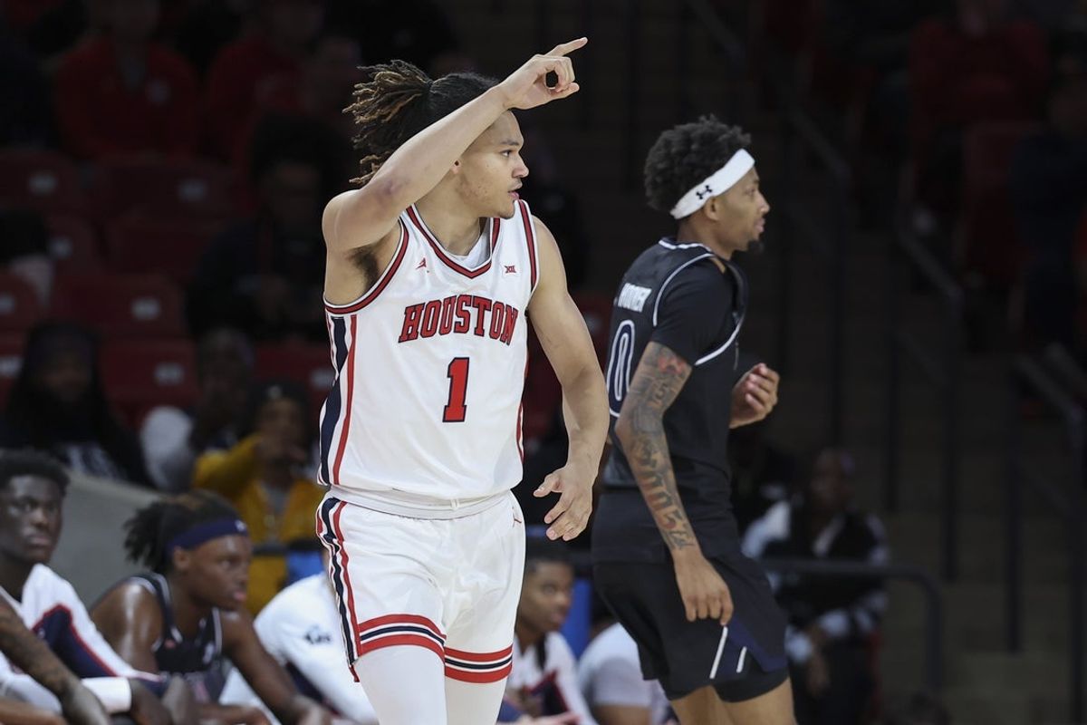 Dec 10, 2025; Houston, Texas, USA; Houston Cougars guard Isiah Harwell (1) reacts after scoring a basket during the first half against the Jackson State Tigers at Fertitta Center. Mandatory Credit: Troy Taormina-Imagn Images