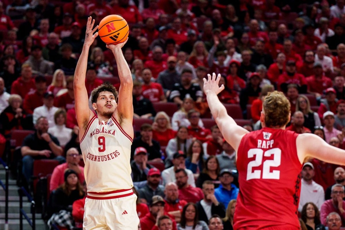 Dec 10, 2025; Lincoln, Nebraska, USA; Nebraska Cornhuskers forward Berke Buyuktuncel (9) shoots a three point basket against Wisconsin Badgers forward Austin Rapp (22) during the first half at Pinnacle Bank Arena. Mandatory Credit: Dylan Widger-Imagn Images