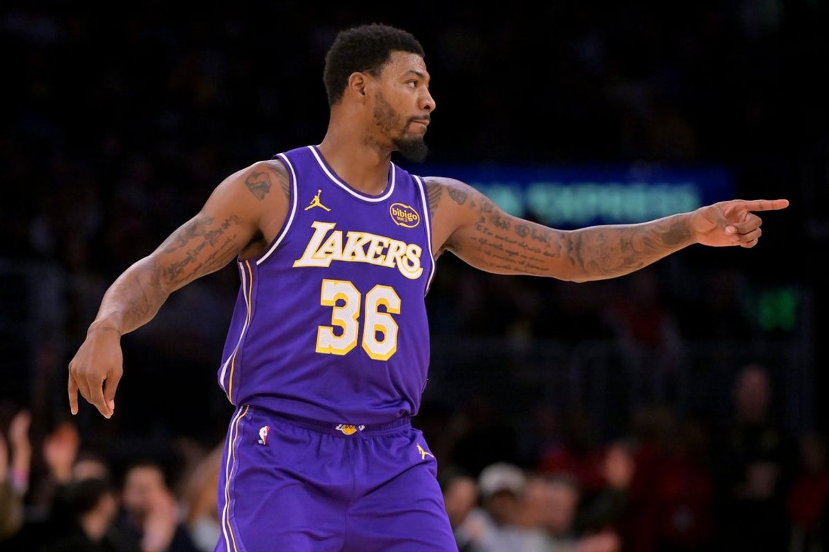 Dec 10, 2025; Los Angeles, California, USA;  Los Angeles Lakers guard Marcus Smart (36) reacts after a 3-point basket during the second half against the San Antonio Spurs at Crypto.com Arena. Mandatory Credit: Jayne Kamin-Oncea-Imagn Images