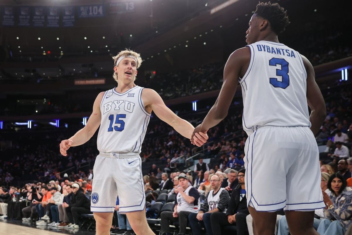 Dec 9, 2025; New York, New York, USA;  BYU Cougars guard Richie Saunders (15) and forward AJ Dybantsa (3) at Madison Square Garden. Mandatory Credit: Wendell Cruz-Imagn Images