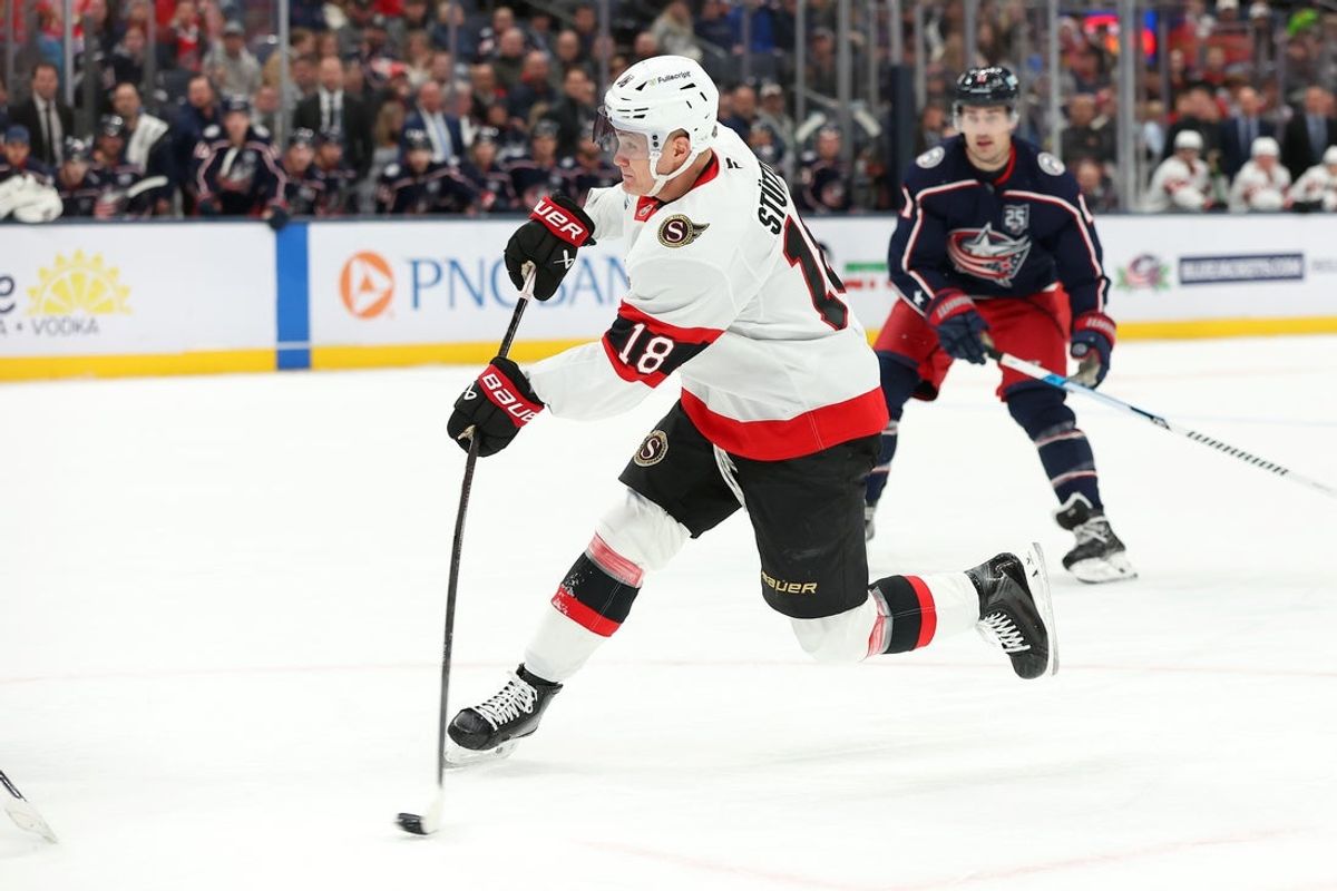 Dec 11, 2025; Columbus, Ohio, USA; Ottawa Senators center Tim Stützle (18) shoots the puck and scores on the play during the first period against the Columbus Blue Jackets at Nationwide Arena. Mandatory Credit: Joseph Maiorana-Imagn Images
