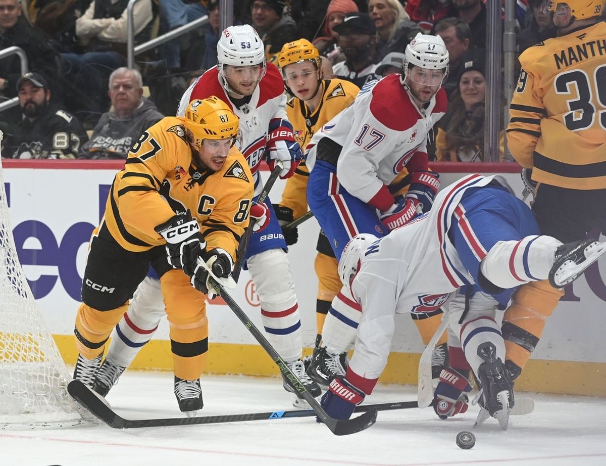 Dec 11, 2025; Pittsburgh, Pennsylvania, USA;  Pittsburgh Penguins center Sidney Crosby (87) goes for the puck as Montreal Canadiens defenseman Mike Gallagher (8) during the first period at PPG Paints Arena. Mandatory Credit: Philip G. Pavely-Imagn Images