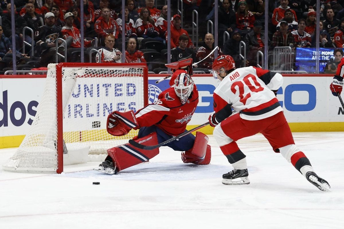 Dec 11, 2025; Washington, District of Columbia, USA; Washington Capitals goaltender Logan Thompson (48) makes a save on Carolina Hurricanes center Sebastian Aho (20) during the second period at Capital One Arena. Mandatory Credit: Geoff Burke-Imagn Images