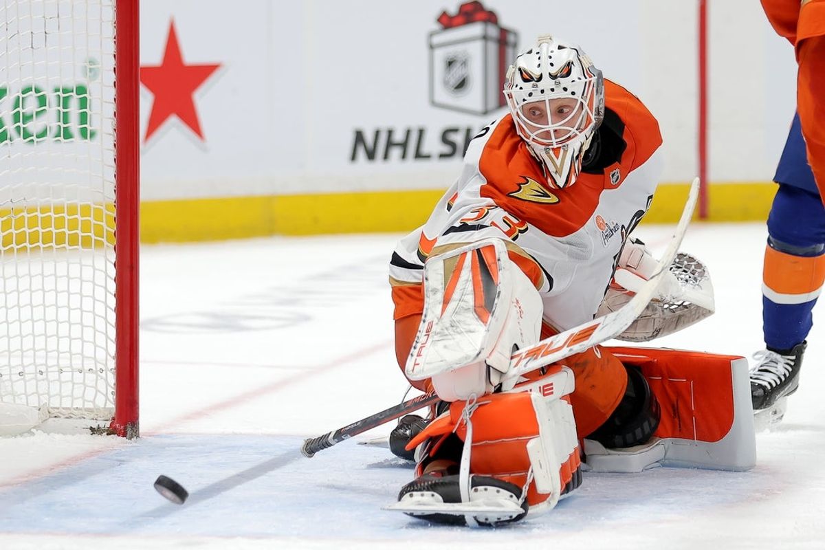 Dec 11, 2025; Elmont, New York, USA; Anaheim Ducks goaltender Ville Husso (33) makes a save against the New York Islanders during the second period at UBS Arena. Mandatory Credit: Brad Penner-Imagn Images