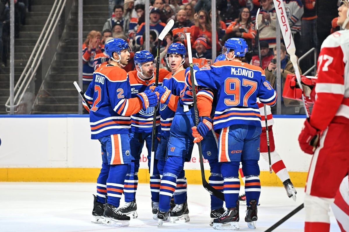 Dec 11, 2025; Edmonton, Alberta, CAN; Edmonton Oilers defenseman Evan Bouchard (2), center Ryan Nugent-Hopkins (93) and center Connor McDavid (97) celebrate a goal on Detroit Red Wings goalie Cam Talbot (39) during the first period at Rogers Place. Mandatory Credit: Walter Tychnowicz-Imagn Images