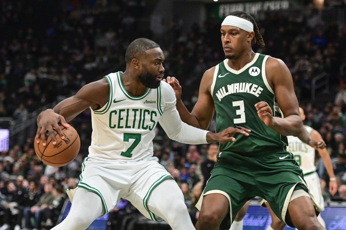 Dec 11, 2025; Milwaukee, Wisconsin, USA;  Boston Celtics forward Jaylen Brown (7) looks for a shot against Milwaukee Bucks center Myles Turner (3) in the third quarter at Fiserv Forum. Mandatory Credit: Benny Sieu-Imagn Images