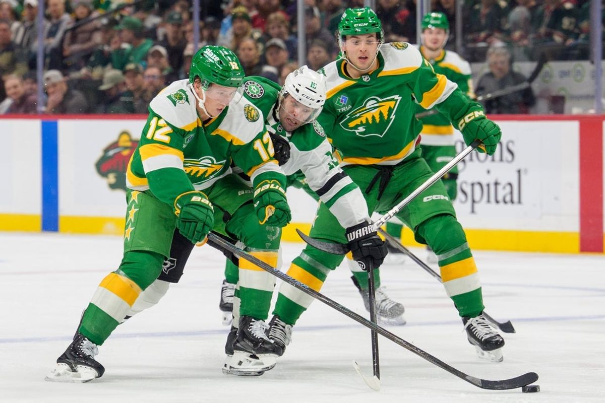 Dec 11, 2025; Saint Paul, Minnesota, USA; Dallas Stars center Colin Blackwell (15) is checked by Minnesota Wild left wing Matt Boldy (12) in the second period at Grand Casino Arena. Mandatory Credit: Matt Blewett-Imagn Images