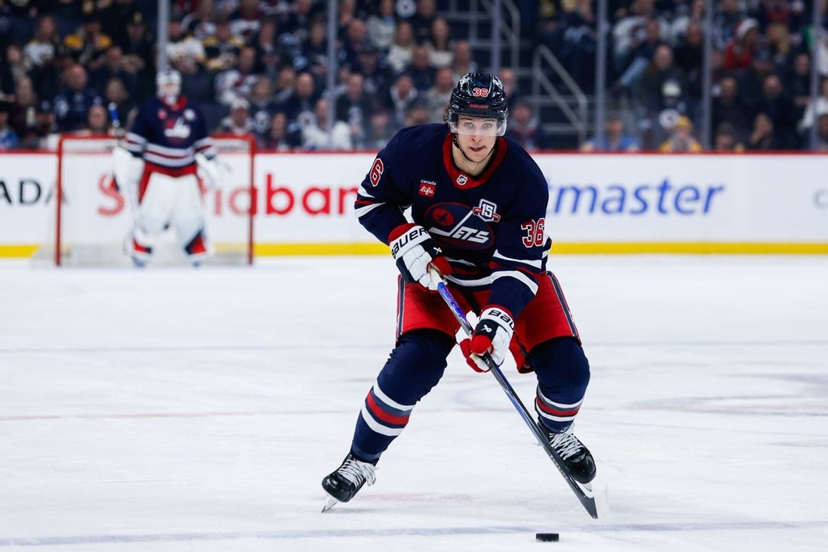 Dec 11, 2025; Winnipeg, Manitoba, CAN; Winnipeg Jets forward Morgan Barron (36) skates into the Boston Bruins zone during the second period at Canada Life Centre.  Mandatory Credit: Terrence Lee-Imagn Images