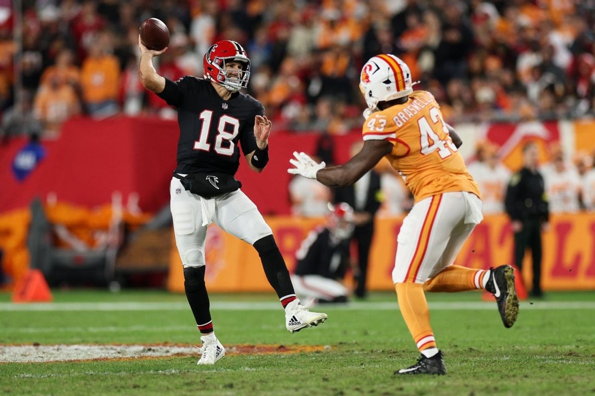 Dec 11, 2025; Tampa, Florida, USA; Atlanta Falcons quarterback Kirk Cousins (18) throws a pass against Tampa Bay Buccaneers linebacker Chris Braswell (43) during the fourth quarter at Raymond James Stadium. Mandatory Credit: Nathan Ray Seebeck-Imagn Images