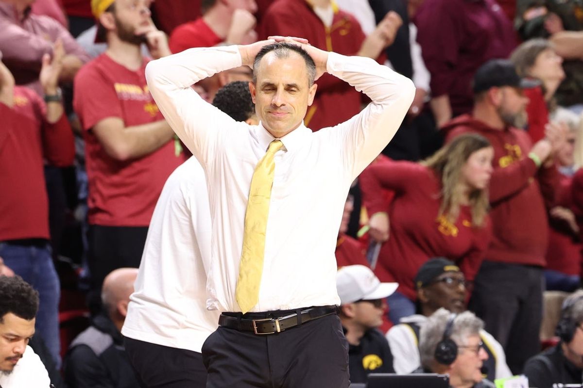 Dec 11, 2025; Ames, Iowa, USA; Iowa Hawkeyes head coach Ben McCollum watches his team play the Iowa State Cyclones during the first half at James H. Hilton Coliseum. Mandatory Credit: Reese Strickland-Imagn Images