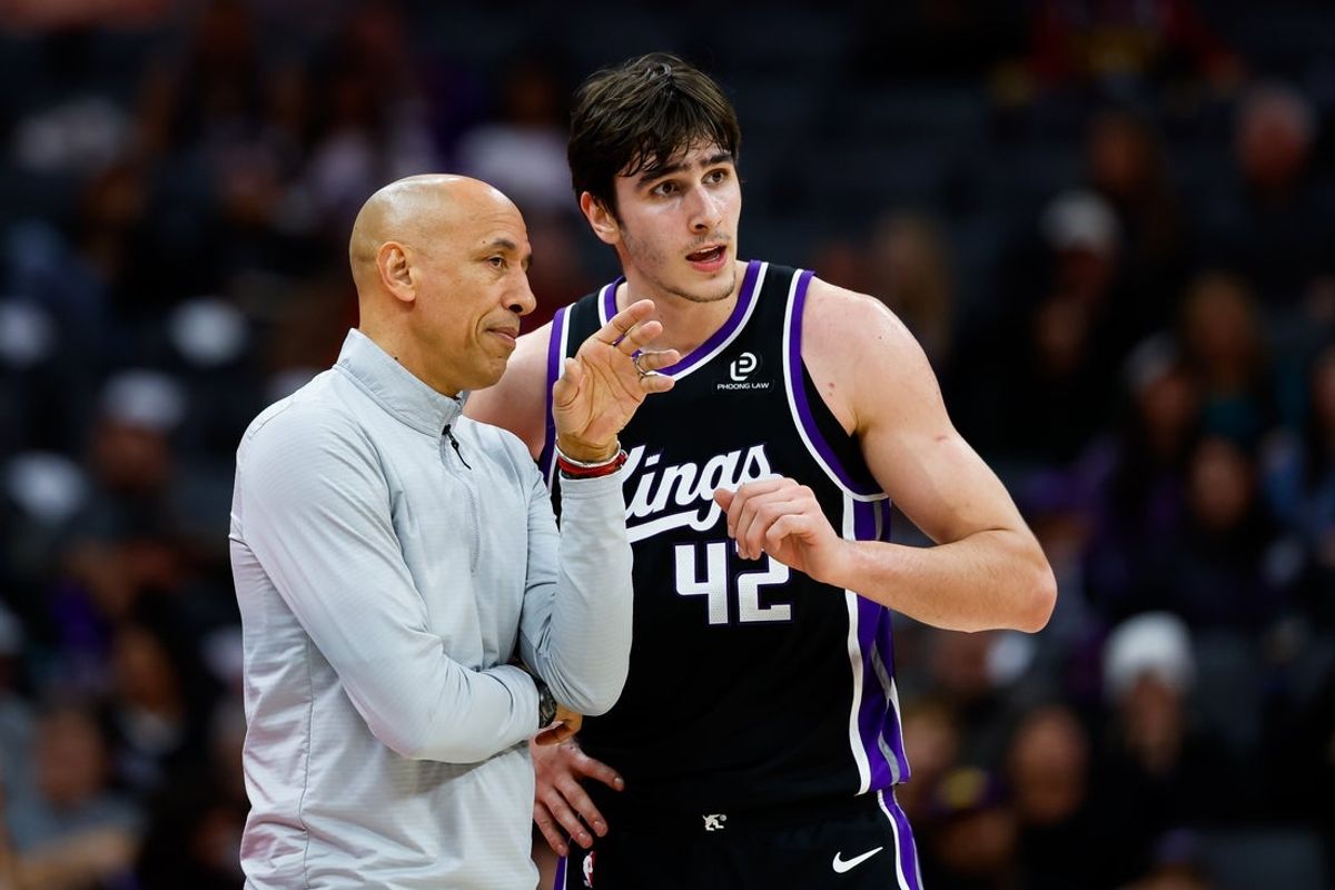 Dec 11, 2025; Sacramento, California, USA; Sacramento Kings head coach Doug Christie talks with center Maxime Raynaud (42) during the fourth quarter against the Denver Nuggets at Golden 1 Center. Mandatory Credit: Sergio Estrada-Imagn Images