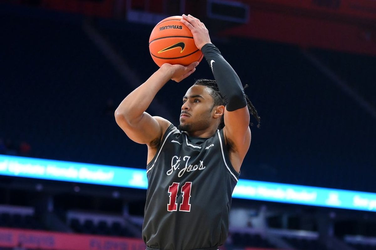 Dec 11, 2025; Syracuse, New York, USA; Saint Joseph's Hawks guard Jaiden Glover-Toscano (11) shoots against the Syracuse Orange during the first half at the JMA Wireless Dome. Mandatory Credit: Rich Barnes-Imagn Images