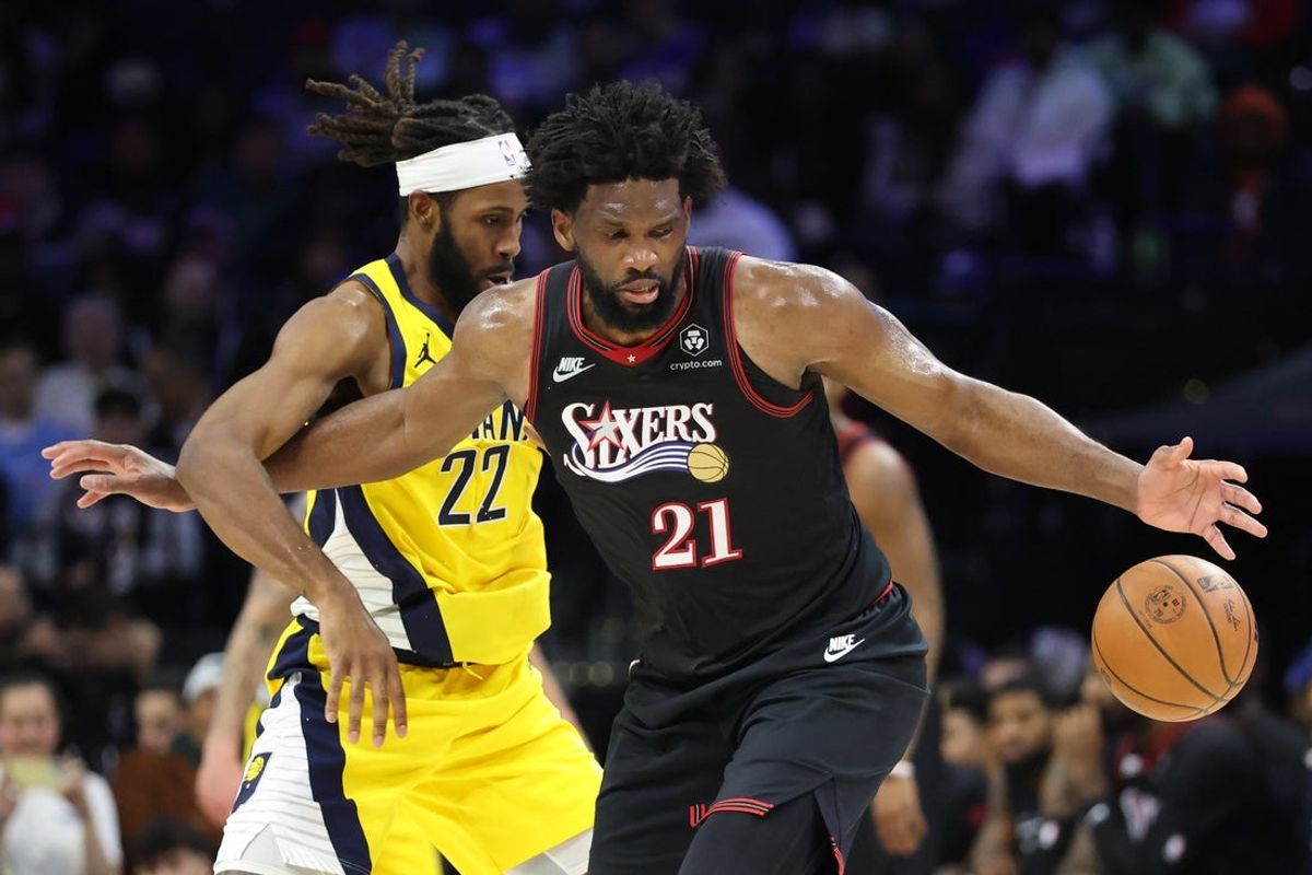Dec 12, 2025; Philadelphia, Pennsylvania, USA; Philadelphia 76ers center Joel Embiid (21) looses control of the ball in front of Indiana Pacers forward Isaiah Jackson (22) during the third quarter at Xfinity Mobile Arena. Mandatory Credit: Bill Streicher-Imagn Images