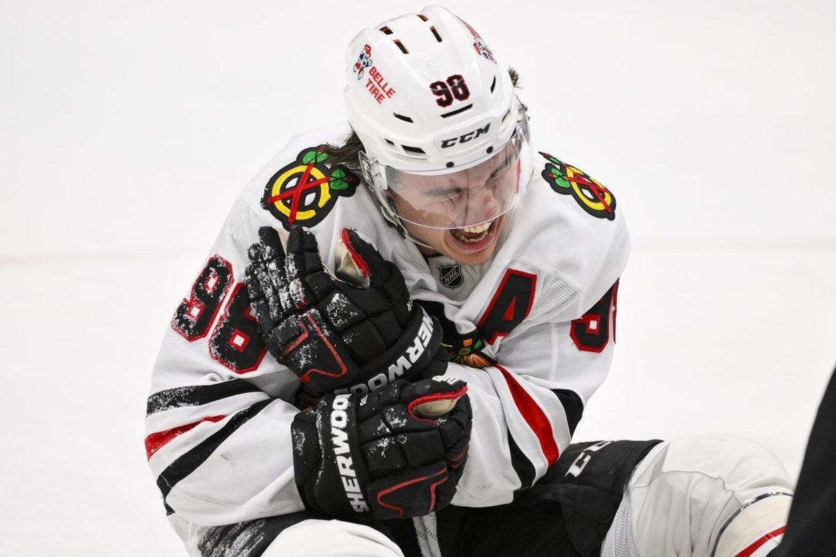 Dec 12, 2025; St. Louis, Missouri, USA; Chicago Blackhawks center Connor Bedard (98) reacts in pain after a face off against St. Louis Blues center Brayden Schenn (not pictured) during the third period at Enterprise Center. Mandatory Credit: Jeff Curry-Imagn Images
