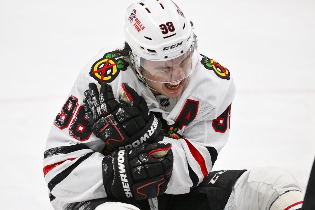 Dec 12, 2025; St. Louis, Missouri, USA; Chicago Blackhawks center Connor Bedard (98) reacts in pain after a face off against St. Louis Blues center Brayden Schenn (not pictured) during the third period at Enterprise Center. Mandatory Credit: Jeff Curry-Imagn Images