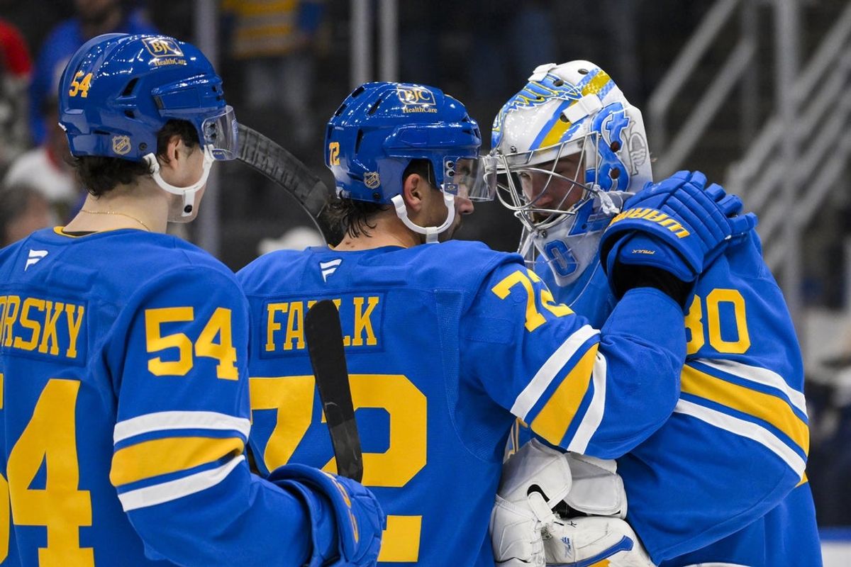Dec 12, 2025; St. Louis, Missouri, USA; St. Louis Blues goaltender Joel Hofer (30) celebrates with defenseman Justin Faulk (72) after the Blues defeated the Chicago Blackhawks at Enterprise Center. Mandatory Credit: Jeff Curry-Imagn Images