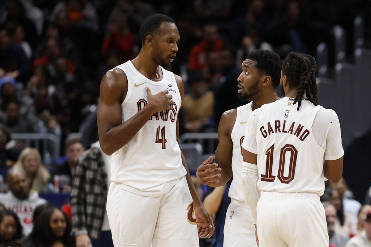 Dec 12, 2025; Washington, District of Columbia, USA; Cleveland Cavaliers guard Donovan Mitchell (45) talks with Cavaliers center Evan Mobley (4) and Cavaliers guard Darius Garland (10) during a stoppage in play against the Washington Wizards in the second half at Capital One Arena. Mandatory Credit: Geoff Burke-Imagn Images