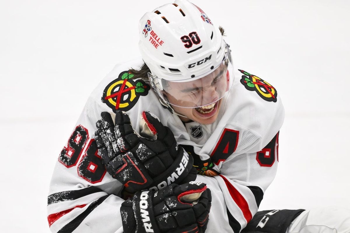 Dec 12, 2025; St. Louis, Missouri, USA; Chicago Blackhawks center Connor Bedard (98) reacts in pain after a face off against St. Louis Blues center Brayden Schenn (not pictured) during the third period at Enterprise Center. Mandatory Credit: Jeff Curry-Imagn Images