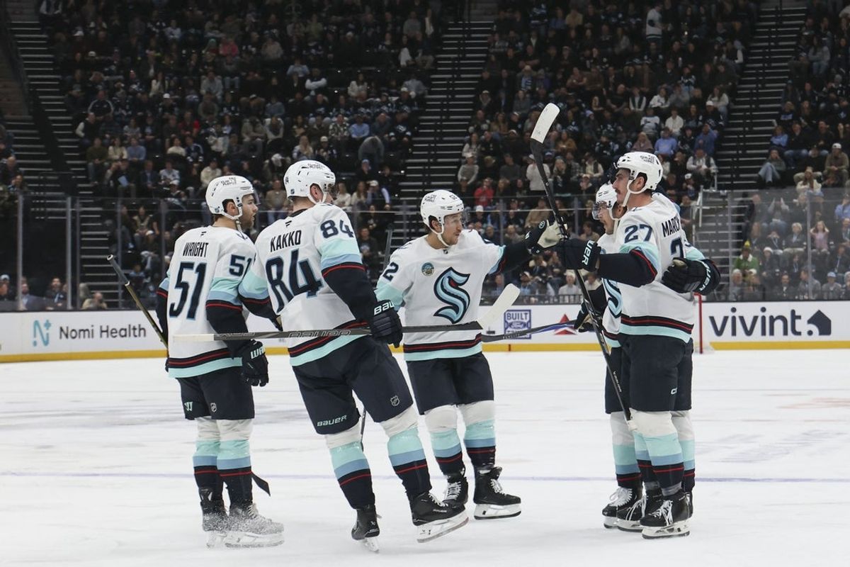 Dec 12, 2025; Salt Lake City, Utah, USA; The Seattle Kraken celebrate a goal by left wing Mason Marchment (27) during the third period of the game against the Utah Mammoth at Delta Center. Mandatory Credit: Rob Gray-Imagn Images