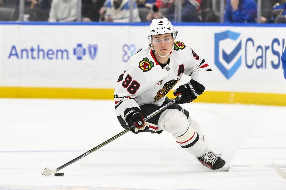 Dec 12, 2025; St. Louis, Missouri, USA; Chicago Blackhawks center Connor Bedard (98) controls the puck against the St. Louis Blues during the third period at Enterprise Center. Mandatory Credit: Jeff Curry-Imagn Images