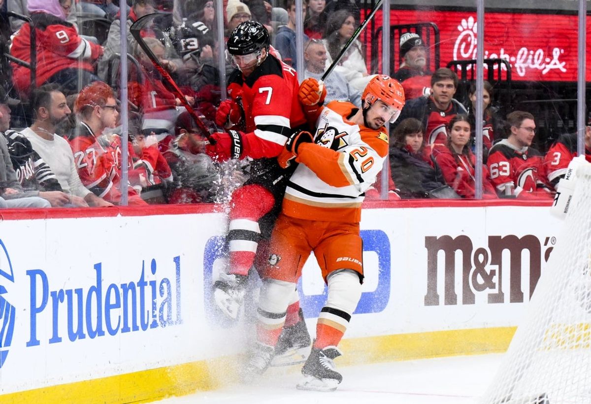 Dec 13, 2025; Newark, New Jersey, USA; Anaheim Ducks left wing Chris Kreider (20) checks New Jersey Devils defenseman Dougie Hamilton (7) during the first period at Prudential Center. Mandatory Credit: John Jones-Imagn Images