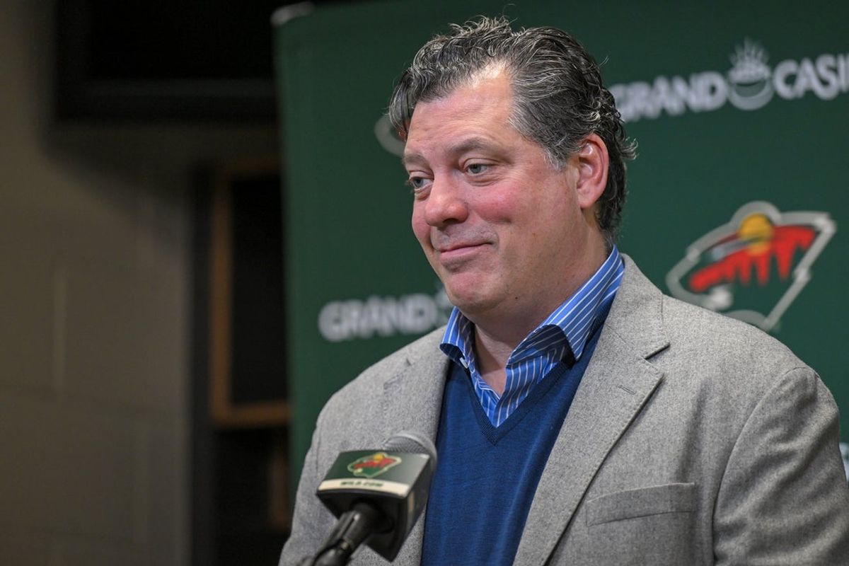 Dec 13, 2025; Saint Paul, Minnesota, USA;  Minnesota Wild general manger Bill Guerin addresses the media about acquiring defensemen Quinn Hughes via trade from the Vancouver Canucks before a game against the Ottawa Senators at Grand Casino Arena. Mandatory Credit: Nick Wosika-Imagn Images